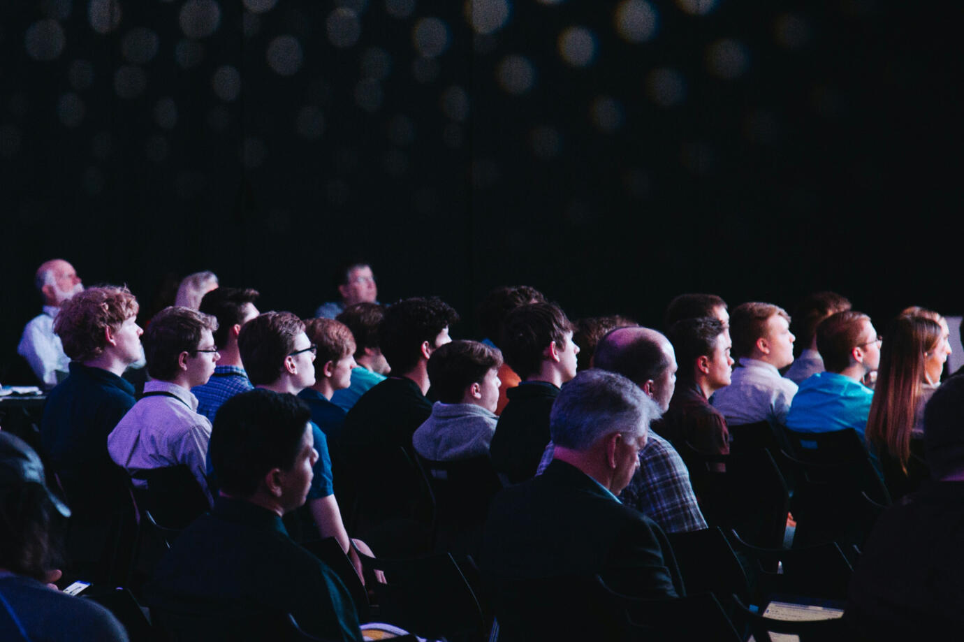audience in a dark venue